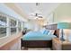 Large main bedroom with a king bed, plenty of natural light, and a ceiling fan at 18198 Burkholder Cir, Port Charlotte, FL 33948