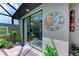 Outdoor patio with sliding glass doors at 237 Albatross Rd, Rotonda West, FL 33947