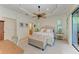 Main bedroom with a king-size bed, ceiling fan, and access to backyard at 237 Albatross Rd, Rotonda West, FL 33947