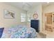 Guest bedroom with coastal decor and ensuite bathroom at 237 Albatross Rd, Rotonda West, FL 33947