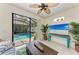 Gathering room with pool view and sliding glass doors at 237 Albatross Rd, Rotonda West, FL 33947