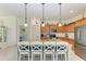 Spacious kitchen with granite countertops, stainless steel appliances, and an island at 237 Albatross Rd, Rotonda West, FL 33947