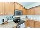 Modern kitchen with granite countertops and stainless steel appliances at 237 Albatross Rd, Rotonda West, FL 33947