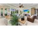 Comfortable living room with large TV and plenty of natural light at 237 Albatross Rd, Rotonda West, FL 33947
