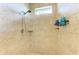 Walk-in shower with tile surround and built-in shelving at 237 Albatross Rd, Rotonda West, FL 33947