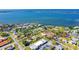 Scenic waterfront neighborhood with beautiful homes, lush greenery, and convenient street access at 275 North Dr, Englewood, FL 34223