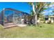 Features a beautiful yard, screened-in patio with a pool, perfect for enjoying outdoor living at 275 North Dr, Englewood, FL 34223