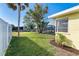 Spacious waterfront backyard with a pool in the screened-in patio, complemented by lush green grass at 275 North Dr, Englewood, FL 34223