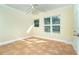 Bedroom with a ceiling fan and two windows at 275 North Dr, Englewood, FL 34223