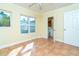 Bedroom features tile floors, neutral walls, and window at 275 North Dr, Englewood, FL 34223