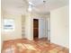 Bedroom featuring terracotta floors, a ceiling fan, and closet with sliding doors at 275 North Dr, Englewood, FL 34223