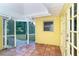 Relaxing screened-in patio with brick flooring and an open view of the backyard at 275 North Dr, Englewood, FL 34223