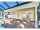 The screened-in pool has direct access to the home's interior with a brick lanai at 275 North Dr, Englewood, FL 34223