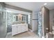 Modern bathroom with double vanity, walk-in shower, and stylish tile at 30 Oakland Hills Pl, Rotonda West, FL 33947