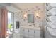 Bathroom with flamingo wallpaper and a white vanity at 30 Oakland Hills Pl, Rotonda West, FL 33947