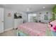 Bedroom with a queen bed, TV, and access to balcony at 30 Oakland Hills Pl, Rotonda West, FL 33947