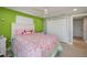 Bright bedroom with a queen bed and decorative flamingo bedding at 30 Oakland Hills Pl, Rotonda West, FL 33947