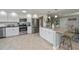 Modern kitchen with stainless steel appliances and white shaker cabinets at 30 Oakland Hills Pl, Rotonda West, FL 33947