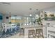 Modern kitchen with granite island, stainless steel appliances, and white cabinets at 30 Oakland Hills Pl, Rotonda West, FL 33947