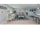 Open concept living room and kitchen with coastal decor at 30 Oakland Hills Pl, Rotonda West, FL 33947