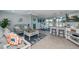Open concept living area with coastal decor and comfortable seating at 30 Oakland Hills Pl, Rotonda West, FL 33947