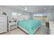 Bright bedroom with king bed, large windows, and plenty of natural light at 30 Oakland Hills Pl, Rotonda West, FL 33947