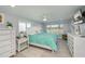 Spacious main bedroom with large windows, king-size bed, and ample dresser space at 30 Oakland Hills Pl, Rotonda West, FL 33947