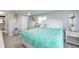 Main bedroom with king-size bed, access to the bathroom, and dresser at 30 Oakland Hills Pl, Rotonda West, FL 33947