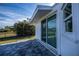 Patio with pavers and sliding glass doors at 30 Oakland Hills Pl, Rotonda West, FL 33947