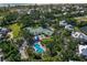 Community pool, tennis courts, and homes at 33 Seawatch Dr, Boca Grande, FL 33921