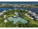 Aerial view of community with tennis courts and pool at 33 Seawatch Dr, Boca Grande, FL 33921