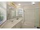 Clean bathroom with a bathtub, shower, and updated vanity at 33 Seawatch Dr, Boca Grande, FL 33921