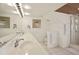 Clean bathroom with double vanity and shower at 33 Seawatch Dr, Boca Grande, FL 33921