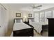 Charming bedroom with twin beds, window seat, and closet at 33 Seawatch Dr, Boca Grande, FL 33921