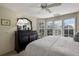 Bright bedroom with a king-size bed, window seat, and built-in dresser at 33 Seawatch Dr, Boca Grande, FL 33921