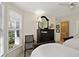 Cozy bedroom with twin beds, dresser, and window seat at 33 Seawatch Dr, Boca Grande, FL 33921