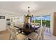 Elegant dining room with a large table and access to a balcony at 33 Seawatch Dr, Boca Grande, FL 33921