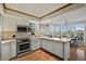 Modern kitchen with stainless steel appliances and a large island at 33 Seawatch Dr, Boca Grande, FL 33921