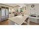 Modern kitchen with stainless steel appliances and a breakfast bar at 33 Seawatch Dr, Boca Grande, FL 33921