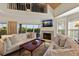 Spacious living room with fireplace and access to balcony at 33 Seawatch Dr, Boca Grande, FL 33921