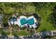 Community pool with lounge chairs and umbrellas at 33 Seawatch Dr, Boca Grande, FL 33921