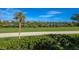 Scenic view of the water, lush landscaping, and homes at 33 Seawatch Dr, Boca Grande, FL 33921