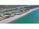 Stunning aerial view of beachfront homes along a pristine coastline with turquoise water at 331 Bocilla Dr, Placida, FL 33946