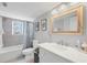 Cozy bathroom featuring a shower and tub combination, vanity, and a decorative mirror at 331 Bocilla Dr, Placida, FL 33946