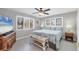 Serene bedroom with calming colors, tile flooring, and ample natural light from multiple windows at 331 Bocilla Dr, Placida, FL 33946