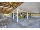 Spacious covered area with seating and a golf cart, perfect for outdoor activities and parking at 331 Bocilla Dr, Placida, FL 33946