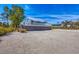 Charming coastal home with a light metal roof, elevated on stilts, surrounded by a shell beach at 331 Bocilla Dr, Placida, FL 33946