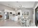 Bright white kitchen featuring stainless steel appliances and an island with bar seating at 331 Bocilla Dr, Placida, FL 33946