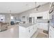 Open-concept living room with a large island and modern lighting fixtures at 331 Bocilla Dr, Placida, FL 33946