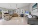 Bright and airy living room featuring tile floors, comfortable seating, and a ceiling fan at 331 Bocilla Dr, Placida, FL 33946